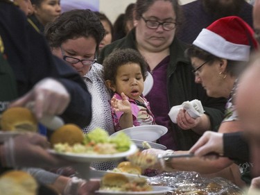 Volunteers serve up hundreds at the Saskatoon Tribal Council's annual Community Christmas Celebration at the White Buffalo Youth Lodge where hundreds of community members join the celebration with a hot turkey dinner and a special visit from Santa Claus for families in need, December 15, 2016.