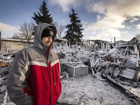 Chance MacDonald stands in front of his home in Dundurn that burned to the ground.