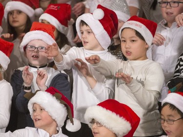 St. Bernard School children were swinging their arms, mimicking the words in the christmas song they were singing "Go Santa Go," during the annual noon hour Christmas festival at TCU Place where schoolchildren from across the city have their turn getting you into the holiday spirit, December 7, 2016.