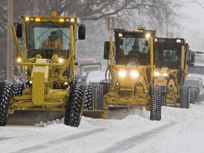 Graders clear 8th Street November 18 2011. (Richard Marjan / Saskatoon StarPhoenix)