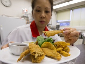 Carmen Ly at the Saskatchewan Food Industry Development Centre Inc, with a plate of 'chicken fingers,' a plant based flour mixed with water and pressed into ribbons which is cooked into non-meat fingers.