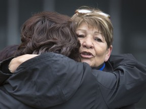 Shirley Isbister, president of the Central Urban Metis Federation Inc., exchanges a hug with Residential School survivor Sharon Clarke at a raising of the reconciliation flag in October 2016. She says a change in the city’s civic naming policy could help Saskatoon become a more inclusive place for all as everyone has to work together towards reconciliation and a more inclusive city.