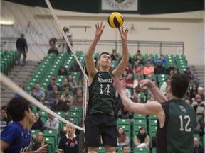 Derek Epp (14) sets the ball during the game against Budo International at the PAC on the University of Saskatchewan.