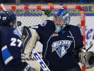 Saskatoon Blades' goalie Brock Hamm makes the save during first period action against the Moose Jaw Warriors at SaskTel Centre in Saskatoon on December 11, 2016.
