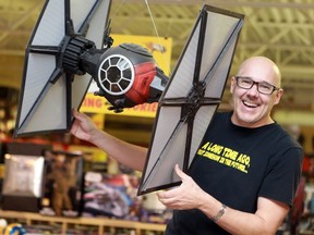 SASKATOON, SK - December 12, 2016 - Tony Antonuk, seen here with his favourite Star Wars prop at Amazing Stories, is a huge Star Wars fan and is excited for this week's release of Rogue One in Saskatoon on December 12, 2016. (Michelle Berg / Saskatoon StarPhoenix)