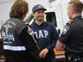 38-year-old Vincent Bitusis speaks with the two paramedics that assisted him after he went into cardiac arrest on December 3 while playing basketball at Holy Cross High School in Saskatoon.