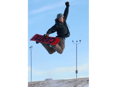 Jaz Gatin snowboards down the Diefenbaker hill during a ride along with Olympic medalist Mark McMorris and his brother Craig McMorris in Saskatoon on December 21, 2016.