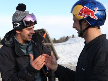 Olympic medalist Mark McMorris and his brother Craig McMorris, member of the Canadian national snowboarding team in slopestyle, shake hands during a meet and greet and ride along at Diefenbaker Park in Saskatoon on December 21, 2016.