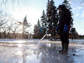 Devin Ostlund fills up the Meewasin skating rink on Spading Crescent during a bitterly cold morning in Saskatoon on Dec. 4, 2016.