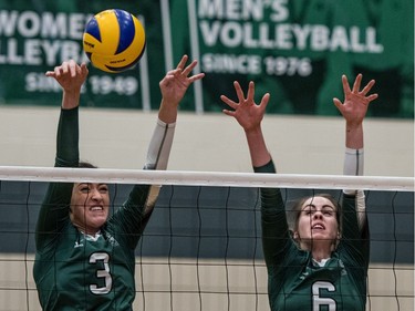 University of Saskatchewan Huskies women's volleyball middle blocker #6 Emmalyn Copping and middle blocker #3 Marguerite Ferguson block against the University of Manitoba Bisons during CIS Women's Volleyball action in Saskatoon, December 3, 2016.