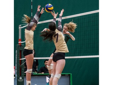 University of Saskatchewan Huskies women's volleyball middle blocker #9 Emily Humbert hits the ball against the University of Manitoba Bisons during CIS Women's Volleyball action in Saskatoon, December 3, 2016.