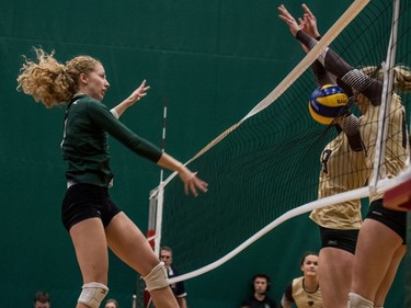 University of Saskatchewan Huskies women's volleyball middle blocker #9 Emily Humbert puts the ball into the net against the University of Manitoba Bisons during CIS Women's Volley ball action in Saskatoon, December 3, 2016.