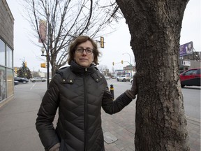 Michelle Chartier of the City of Saskatoon poses beside a black ash tree on 20th street West, Monday, December 05, 2016. About 150 trees could be on the chopping block due to an insect infestation.