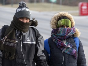 SASKATOON,SK-- December 07/2016  1208 news weather ----- Husband and wife Khushbu and Hardik Shah walk along Pinehouse Drive bundled for the weather, Wednesday, December 07, 2016.  (GREG PENDER/STAR PHOENIX)