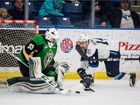 Saskatoon Blades Chase Wouters and Gage Ramsay celebrate Braylon Shmyr's first period goal against the Prince Albert Raiders on Dec. 28, 2016 at SaskTel Centre.