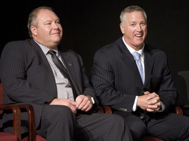 Huskies Dog Breakfast in May, 2008. Huskies coach Brian Towriss (left) and keynote speaker Matt Dunigan share a laugh during the annual University of Saskatchewan Huskies football team Dog's Breakfast Friday at Prairieland Park. The event is one of the largest fundraisers for the team. (Star Phoenix photo by Greg Pender.)