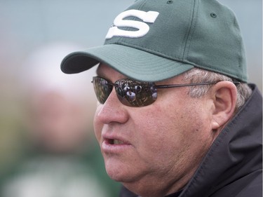 Head coach Brian Towriss speaks to his players, who are reflected in his sunglasses,  during the University of Saskatchewan Huskies spring camp at Griffiths Stadium on Sunday, May 3rd, 2015.(LIAM RICHARDS/STAR PHOENIX)