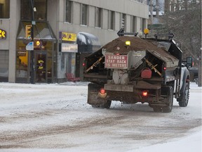 A truck applies sand and salt near the intersection of Broadway Avenue and 12th Street in November of 2013 in Saskatoon. (GREG PENDER/The StarPhoenix)