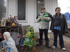 Kathy Chambers and son Sebastien stand outside of their home in Saskatoon, SK. on Saturday, December 3, 2016.  (LIAM RICHARDS/THE STAR PHOENIX)