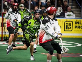 The Saskatchewan Rush's Matt Hossack chases down Calgary Roughnecks #91 Matt Symes during first half action in Saskatoon, SK. on Friday, December 16, 2016.