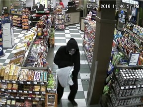 Two masked male suspects brandishing a firearm robbed a business in the 3700 Block of Diefenbaker Drive just before midnight Friday, police say. Submitted photo