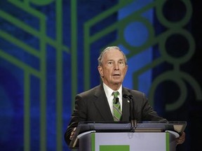 FILE - In this Thursday, Dec. 1, 2016 file photo, former New York City Mayor Michael Bloomberg announces award nominees during the C40 Cities Award presentation in Mexico City. The eight individuals who own as much as half of the rest of the planet are all men, and have largely made their fortunes in technology. Bloomberg created the eponymous financial information provider in 1981 after getting laid off from an investment bank and made it a lucrative business in particular by selling data termi