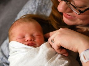 Vanessa Russell takes a look at her baby boy, Lachlan Kai Russell IV, Saskatoon's first baby of 2017, at Royal University Hospital on January 1, 2017.