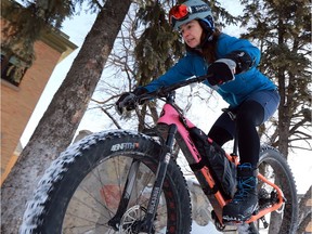 Sarah Robbins rides her fat bike in front of Victoria School in Saskatoon on January 24, 2017. (Michelle Berg / Saskatoon StarPhoenix)