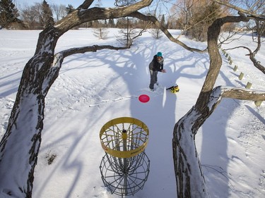 Casey Murray plays a round of disc golf at Diefenbaker Park in Saskatoon, January 12, 2017. Murray didn't seem to be bothered by the extremely low temperature.