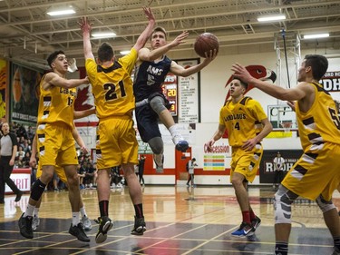 St. Francis Xavier Rams guard Liam Harrison drives the lane against the Dr. Martin Leboldus Suns during their game in the Bedford Road Invitational Tournament (BRIT) at Bedford Road Collegiate in Saskatoon, January 13, 2017.
