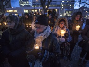 Hundreds of people gathered at city hall in Saskatoon at a vigil for the victims of the attack on a mosque in Quebec City and to protest the U.S. travel ban on Jan. 31.