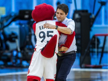 Canadian Prime Minister Justin Trudeau and Toronto Raptor mascot The Raptor during a visit by students  of La Loche Community School at the BioSteel Centre, where the Toronto Raptors practice, in Toronto, Ont. on Friday January 13, 2017.  Masai Ujiri, Toronto Raptors president and general manager, hosted a group of 10 kids, plus two teachers, from La Loche, Saskatchewan. Ernest Doroszuk/Toronto Sun/Postmedia Network