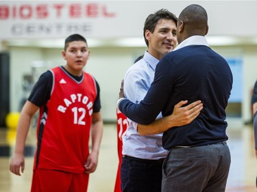 Canadian Prime Minister Justin Trudeau and Toronto  Raptors president and general manager Masai Ujiri during a visit from students from La Loche Community School at the BioSteel Centre, where the Toronto Raptors practice, in Toronto, Ont. on Friday January 13, 2017.  Masai Ujiri, Toronto Raptors president and general manager, hosted a group of 10 kids, plus two teachers, from La Loche, Saskatchewan. Ernest Doroszuk/Toronto Sun/Postmedia Network