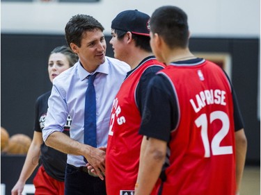 Canadian Prime Minister Justin Trudeau greets a student during a visit from students from La Loche Community School at the BioSteel Centre, where the Toronto Raptors practice, in Toronto, Ont. on Friday January 13, 2017.  Masai Ujiri, Toronto Raptors president and general manager, hosted a group of 10 kids, plus two teachers, from La Loche, Saskatchewan. Ernest Doroszuk/Toronto Sun/Postmedia Network