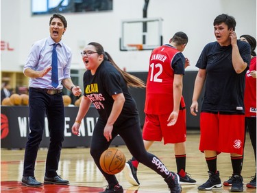 Canadian Prime Minister Justin Trudeau looks on as  visiting students from La Loche Community School do basketball drills at the BioSteel Centre, where the Toronto Raptors practice, in Toronto, Ont. on Friday January 13, 2017.  Masai Ujiri, Toronto Raptors president and general manager, hosted a group of 10 kids, plus two teachers, from La Loche, Saskatchewan. Ernest Doroszuk/Toronto Sun/Postmedia Network