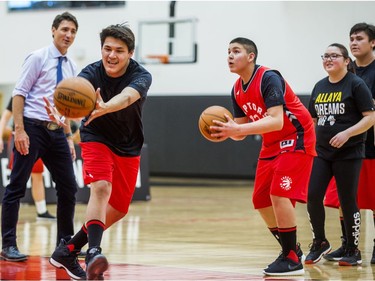 Canadian Prime Minister Justin Trudeau looks on as  visiting students from La Loche Community School do basketball drills at the BioSteel Centre, where the Toronto Raptors practice, in Toronto, Ont. on Friday January 13, 2017.  Masai Ujiri, Toronto Raptors president and general manager, hosted a group of 10 kids, plus two teachers, from La Loche, Saskatchewan. Ernest Doroszuk/Toronto Sun/Postmedia Network