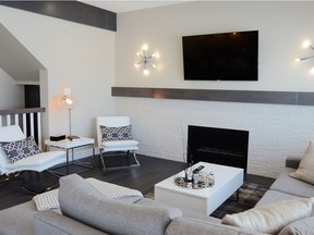 D & S Homes chose a contemporary decor theme for its Brighton parade home at 302 Secord Way, featuring a crisp white and grey colour palette. Decorative wood beams in a rich grey tone highlight the elevated ceiling as well as the linear gas fireplace, which is beautifully framed in white stone. (Photo: Jeannie Armstrong)