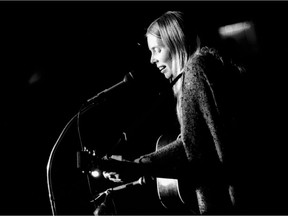 Joni Mitchell performing at a benefit concert for Greenpeace on Oct. 16, 1970.