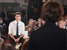 Prime Minister Justin Trudeau listens to a question during a town hall in Sherbrooke, Que. on Tuesday, January 17, 2017.