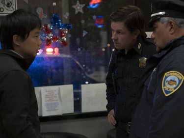 Jimmy O. Yang (L) and Mark Wahlberg star in "Patriots Day."