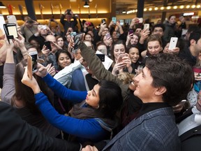 Prime Minister Justin Trudeau makes his way through the selfie snapping crowds at the University of Regina on Thursday January 26, 2017.