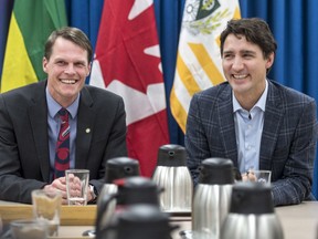 Prime Minister Justin Trudeau, right, speaks with Saskatoon Mayor Charlie Clark and city councillors at City Hall in Saskatoon on Wednesday, January 25, 2017.