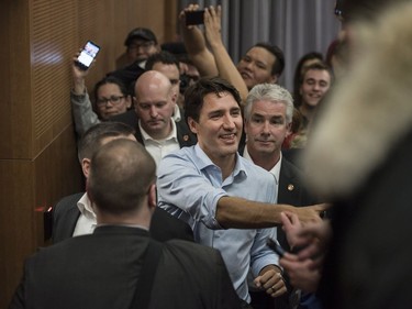 Prime Minister Justin Trudeau shakes hands as he leaves the room after speaking with the public in a lecture hall at the Health Sciences Building on the University of Saskatchewan campus in Saskatoon, January 25, 2017.