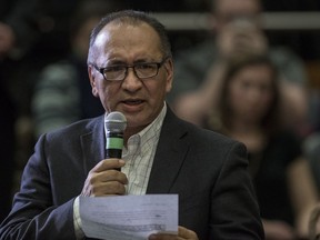 Tribal Chief of the Saskatoon Tribal Council Felix Thomas asks a question to Prime Minister Justin Trudeau, as he speaks with the public in a lecture hall at the Health Sciences Building on the University of Saskatchewan campus in Saskatoon, January 25, 2017.