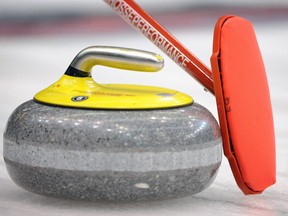 Team Canada skip Jeff Stoughton holds his broom to the rock to call a shot against Team Sweden at the world men's curling championships at the Brandt Centre in Regina on April 6, 2011. (Don Healy / Regina Leader-Post)