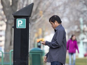 Saskatoon city council voted Monday to approve new restrictions on panhandling, including of those using a parking pay station or lining up to use them. (GORD WALDNER/The StarPhoenix)