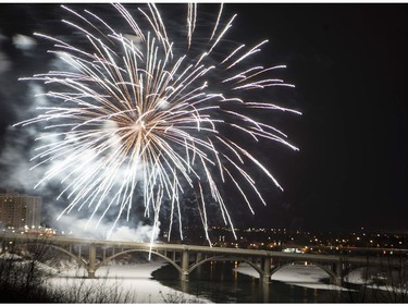 Fireworks are displayed on the Broadway Bridge for the Canada 150 celebration in Saskatoon, Sask., Saturday Dec. 31, 2016.