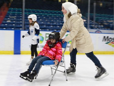 Newcomers Bouchra Alzein and Noura Alzein take to the ice for the first time.