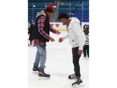 Newcomers take to the ice for the first time with the Saskatoon Blades during their "Welcome the World" event at SaskTel Centre.