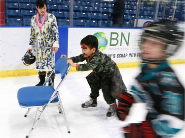 Newcomers Yuxian Wang and Jay Wang take to the ice for the first time with the Saskatoon Blades.